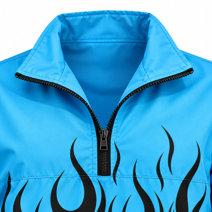 Close-up of blue and dark flame jacket showing the black half zipper, wide white stand collar facing and printed front panel.