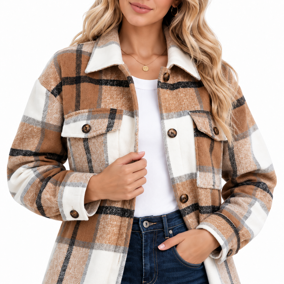 Women shacket close front detail showing collar, chest flap pockets, buttons, plaid pattern and fabric texture on white.