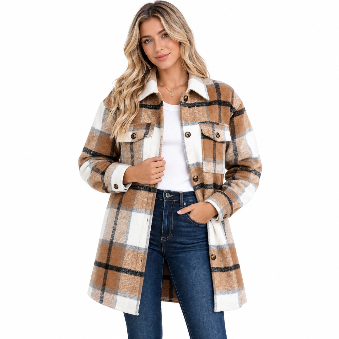 Women shacket front view with plaid button design, chest pockets and longline shape styled with jeans on a white background.