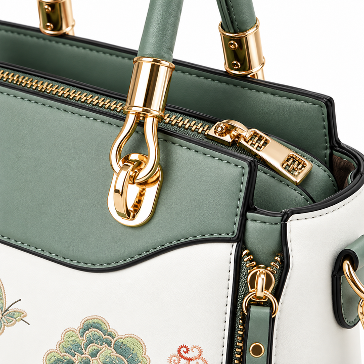 Close-up of shoulder bag gold-tone hardware, zipper, stitching and Sage Green trim