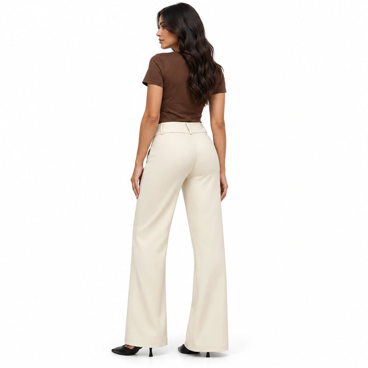 Back three-quarter view of beige wide-leg trousers on a model against a white studio background.