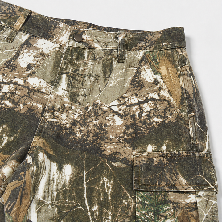 Camouflage high waist pants close-up showing the waistband and cargo pocket details for a clearer view of the product design.