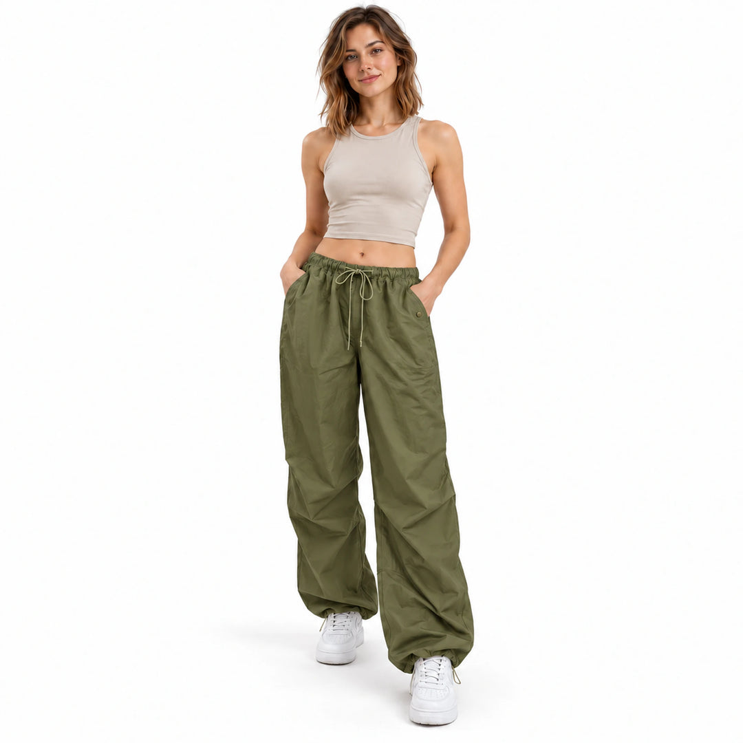 Army green cargo trousers on a standing model with a gathered drawstring waist, full-length legs and casual everyday styling.