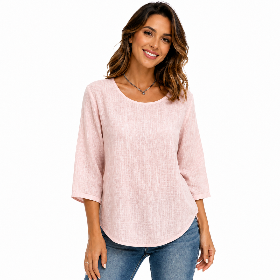 Pink solid-color crew neck top with three-quarter sleeves and relaxed shape, displayed clearly for product comparison online.