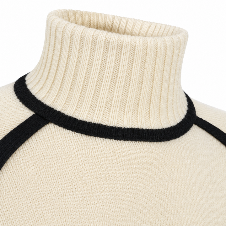 Close-up of ribbed turtleneck and black contrast trim on women&