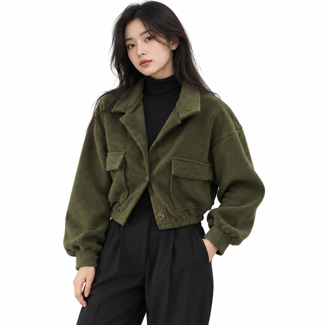 Adult model wearing the Green cropped button jacket with stand collar and flap pockets