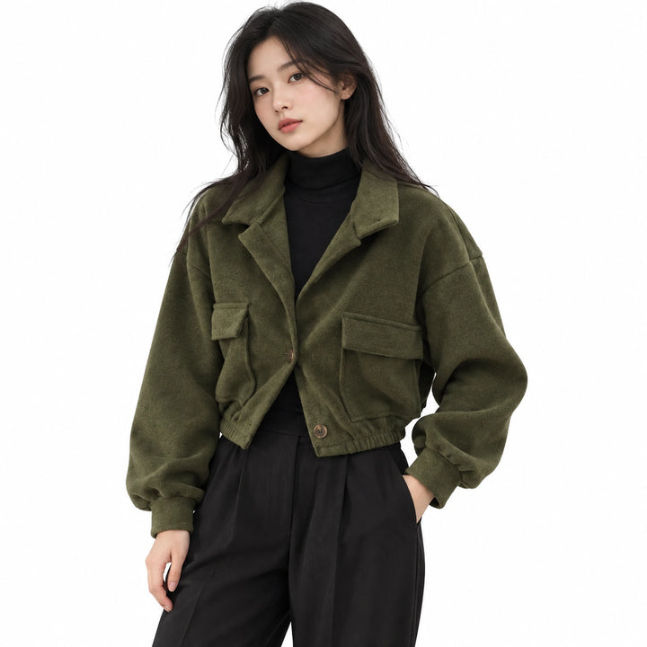 Adult model wearing the Green cropped button jacket with stand collar and flap pockets