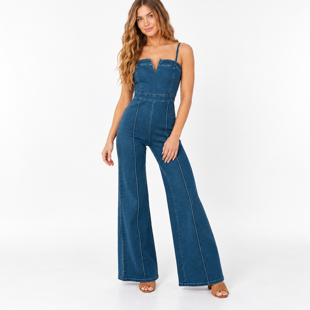 Full-length front view of the medium blue denim jumpsuit on a model against a white background.