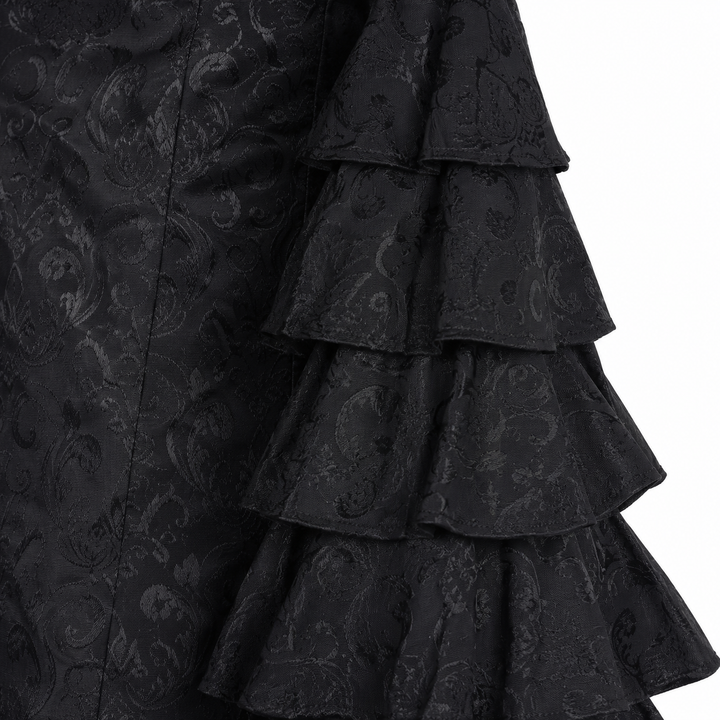 Close-up of black fishtail long skirt layered ruffle detail and textured surface