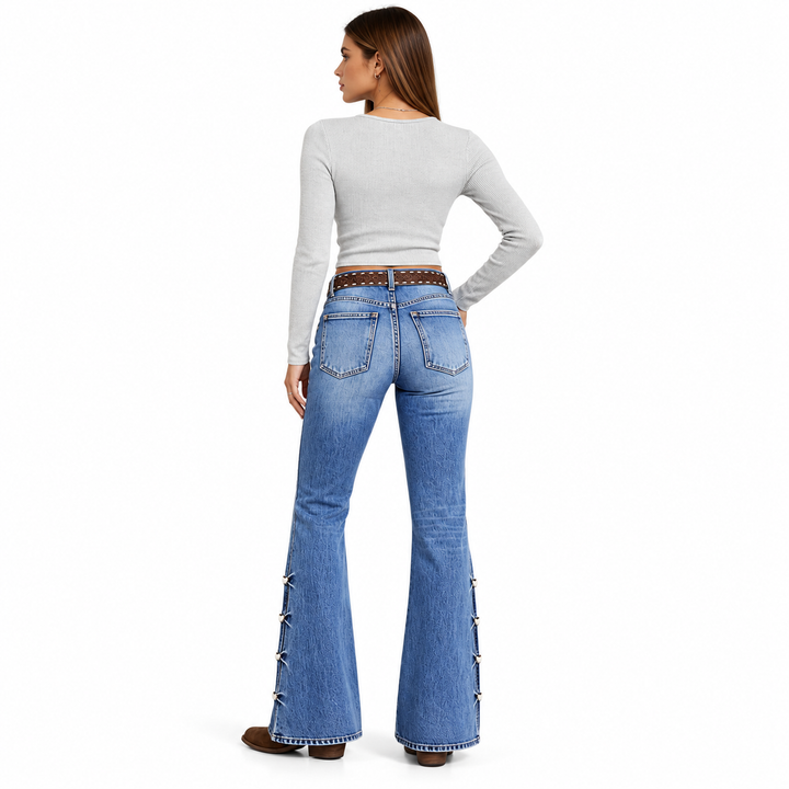 Blue flare jeans on model, back view with patch pockets