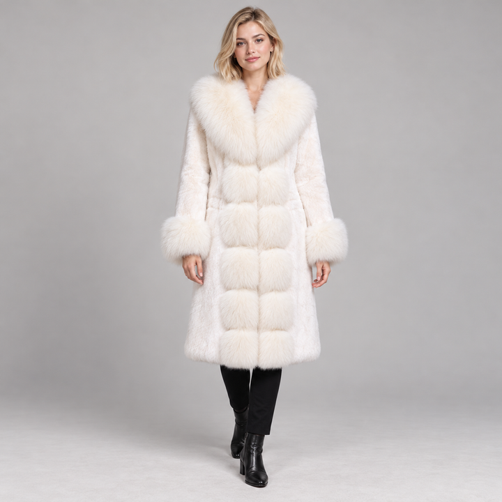 White long-sleeve coat with wide pile collar and cuffs, worn by a full-body model in a gray studio.