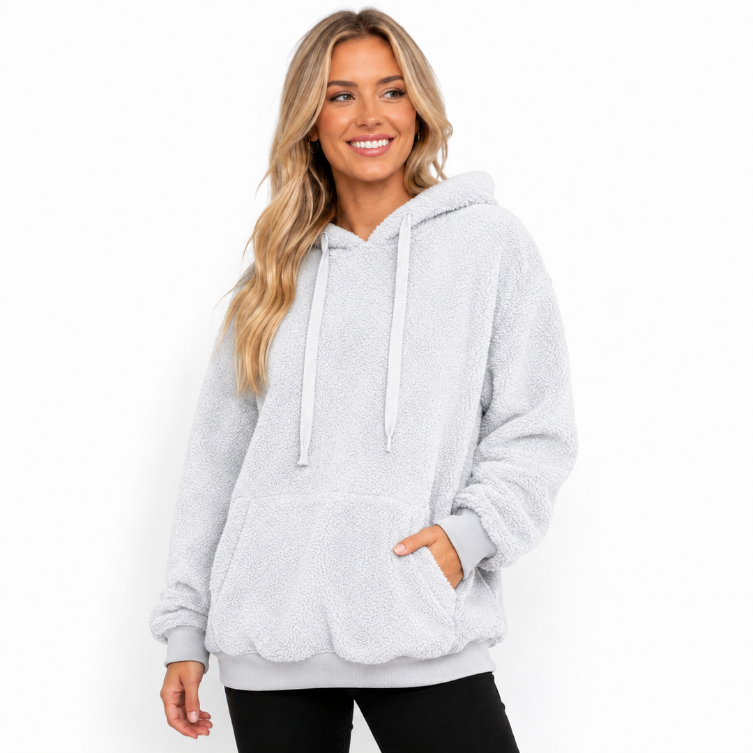 Women's fleece hoodie in light gray on a model with hood, drawstrings, kangaroo pocket, cuffs and hem in a clean studio view.