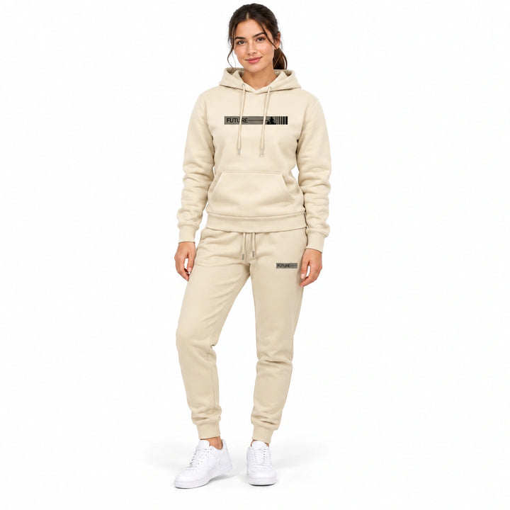 Woman wearing the apricot cream hoodie and matching apricot cream pants set on a white background