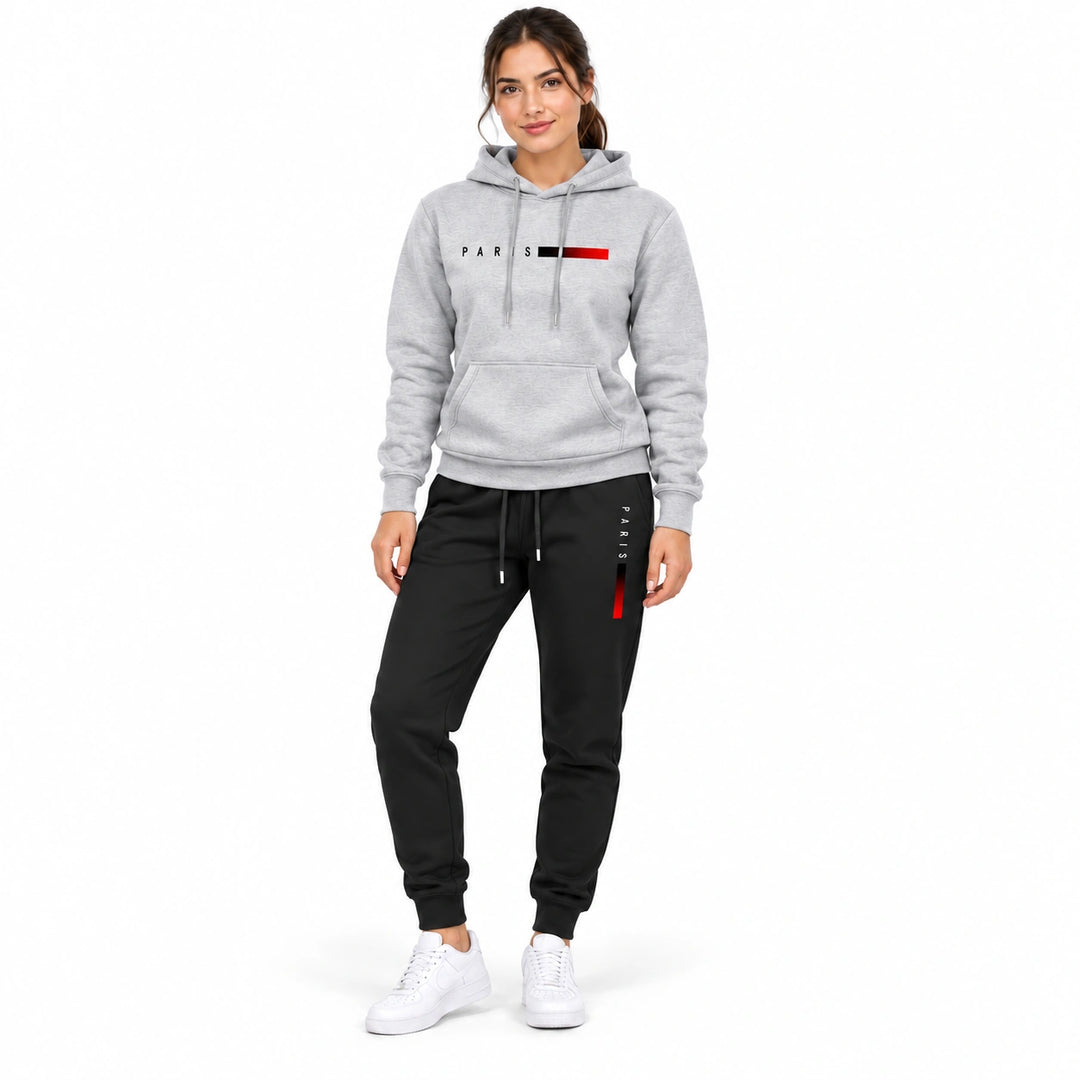Woman wearing the light gray PARIS hoodie and black PARIS pants set on a white background
