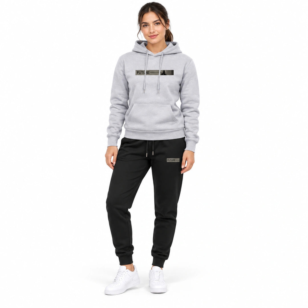 Woman wearing the light gray graphic hoodie and black matching pants set