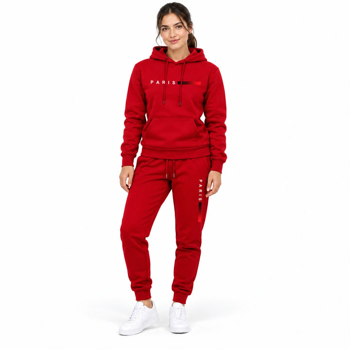 Woman wearing the red hoodie and matching red pants set on a white background