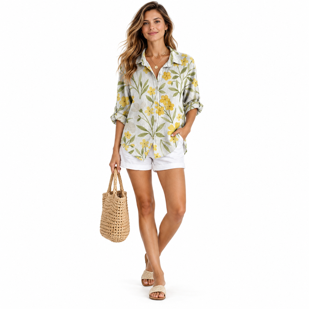 Floral blouse in yellow botanical print on full-body model, front view