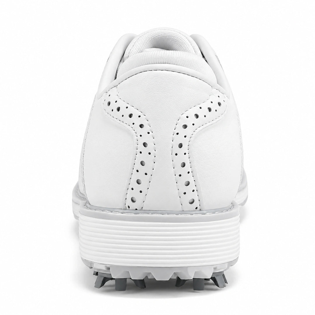 Rear view of the white golf shoes showing heel stitching and the ribbed sole