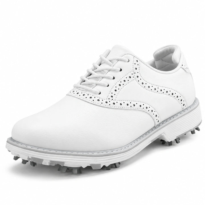 Three-quarter view of white lace-up golf shoes with punched trim and gray cleats