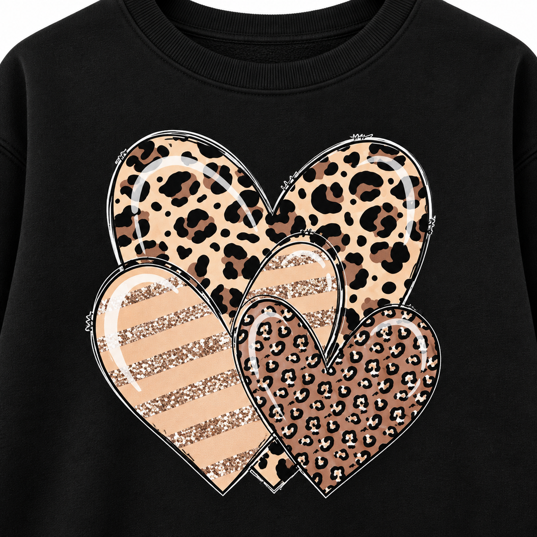 Close-up of the Black top showing the leopard heart graphic, print detail and neckline.
