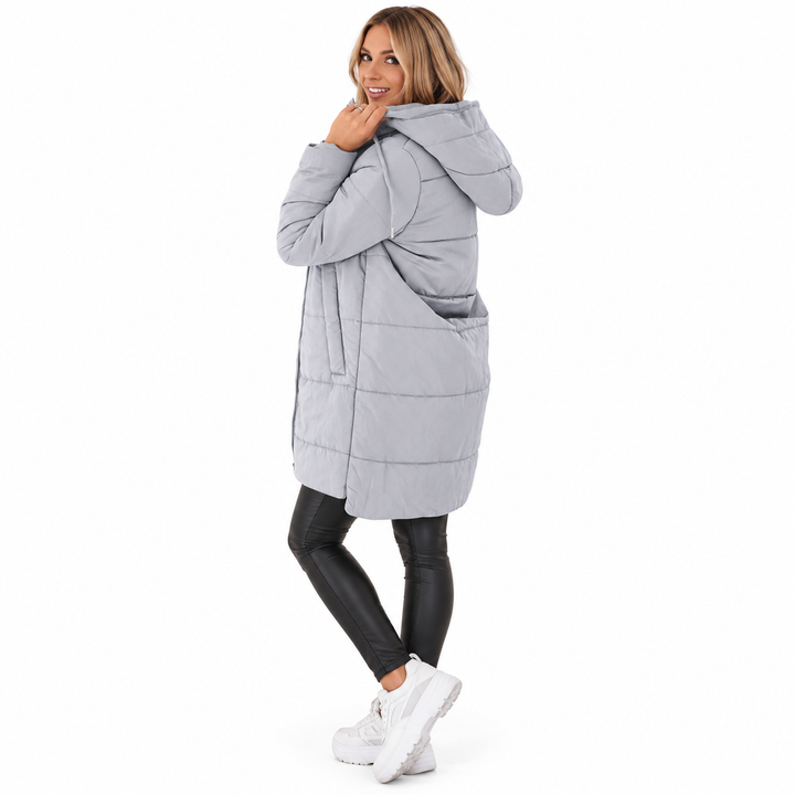 Gray hooded jacket on a full-body model in the rear three-quarter pose showing its lined hood and horizontal stitched panels.