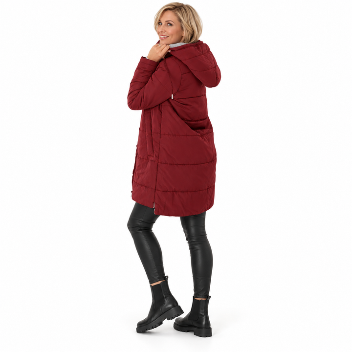Red hooded jacket on a different full-body model in the rear three-quarter view, showing hood and horizontal stitched panels.