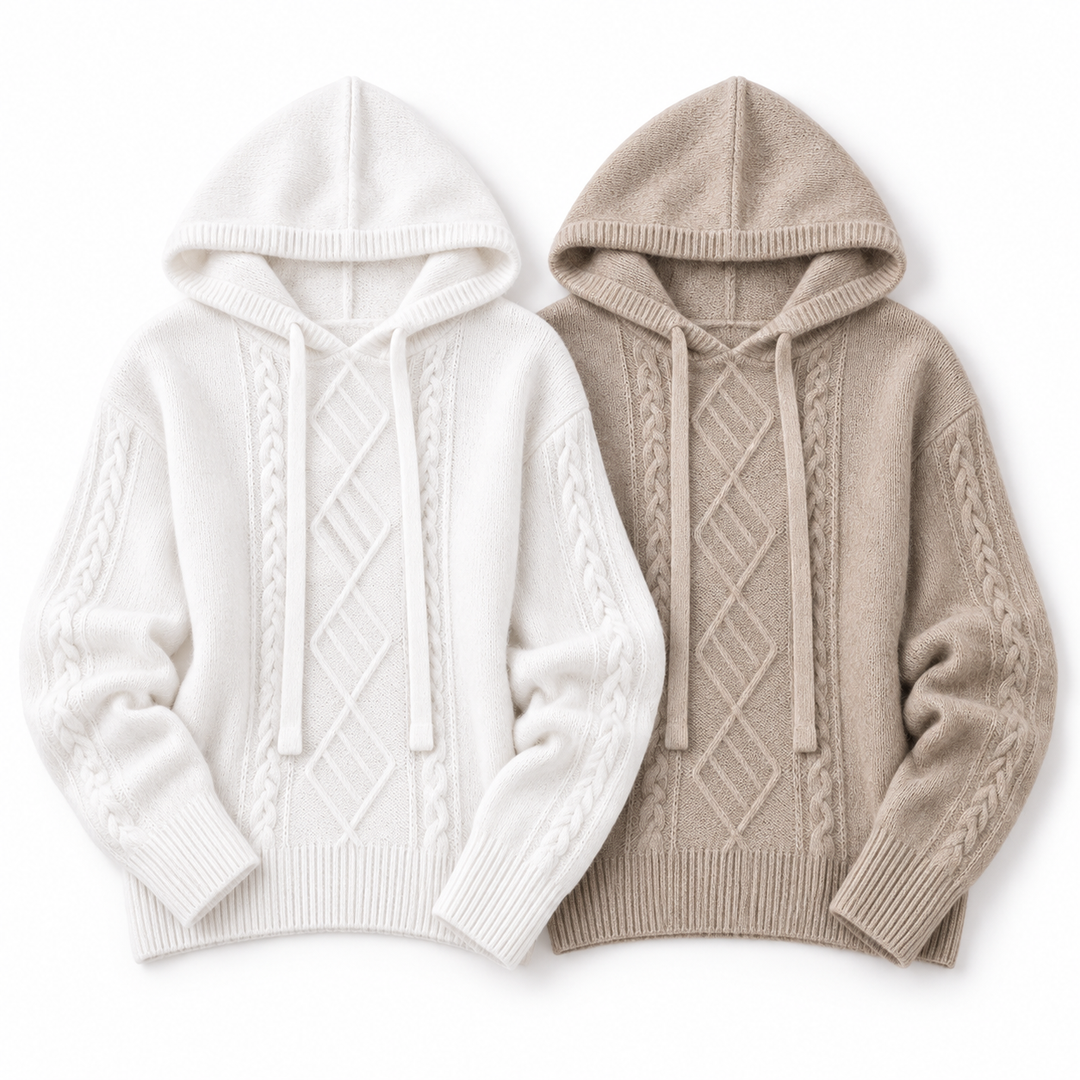 White and light camel hooded jacquard knit sweaters arranged side by side on a white background to compare the two color options.