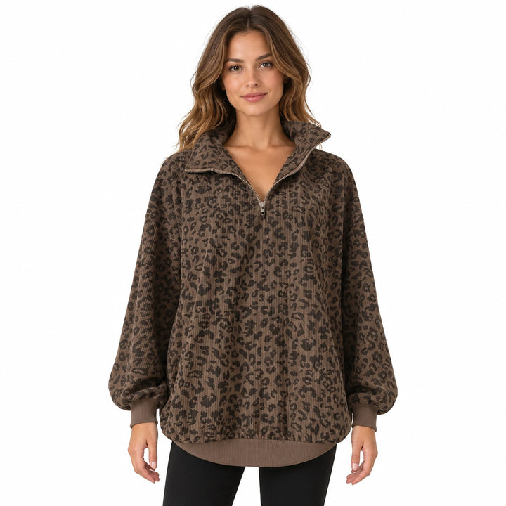 Adult model wearing a coffee-brown leopard print quarter zip pullover with a loose drape