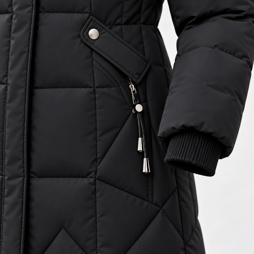 Black long puffer coat detail showing pocket, zipper, cuff and quilting