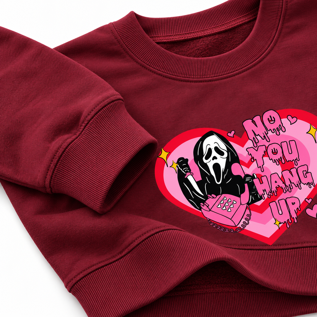 Burgundy love print sweatshirt close-up showing cuff, neckline and printed design
