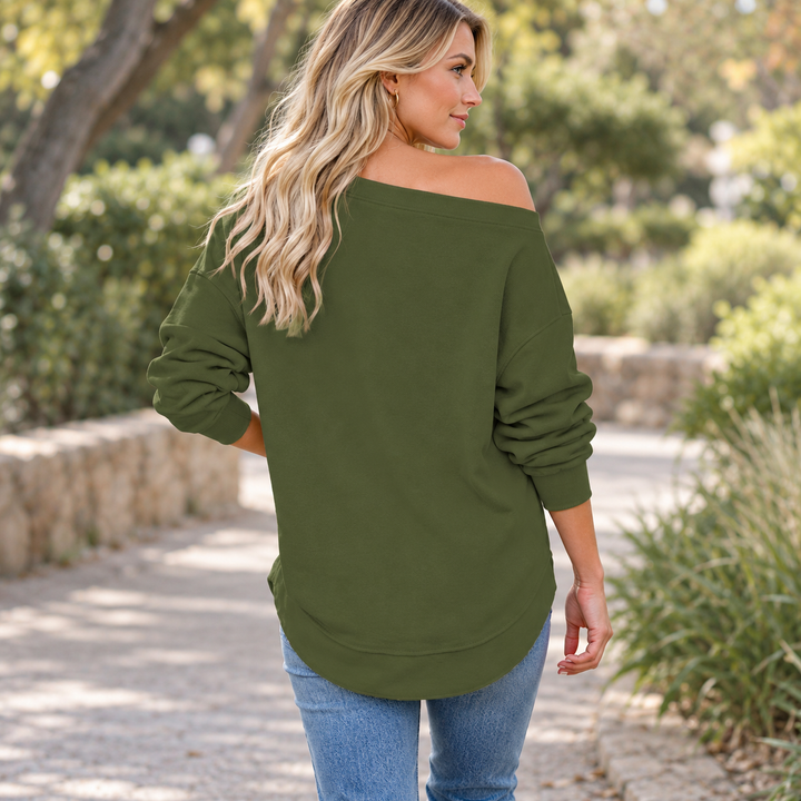 Army Green off-shoulder sweatshirt shown from the back on a model during a park walk.