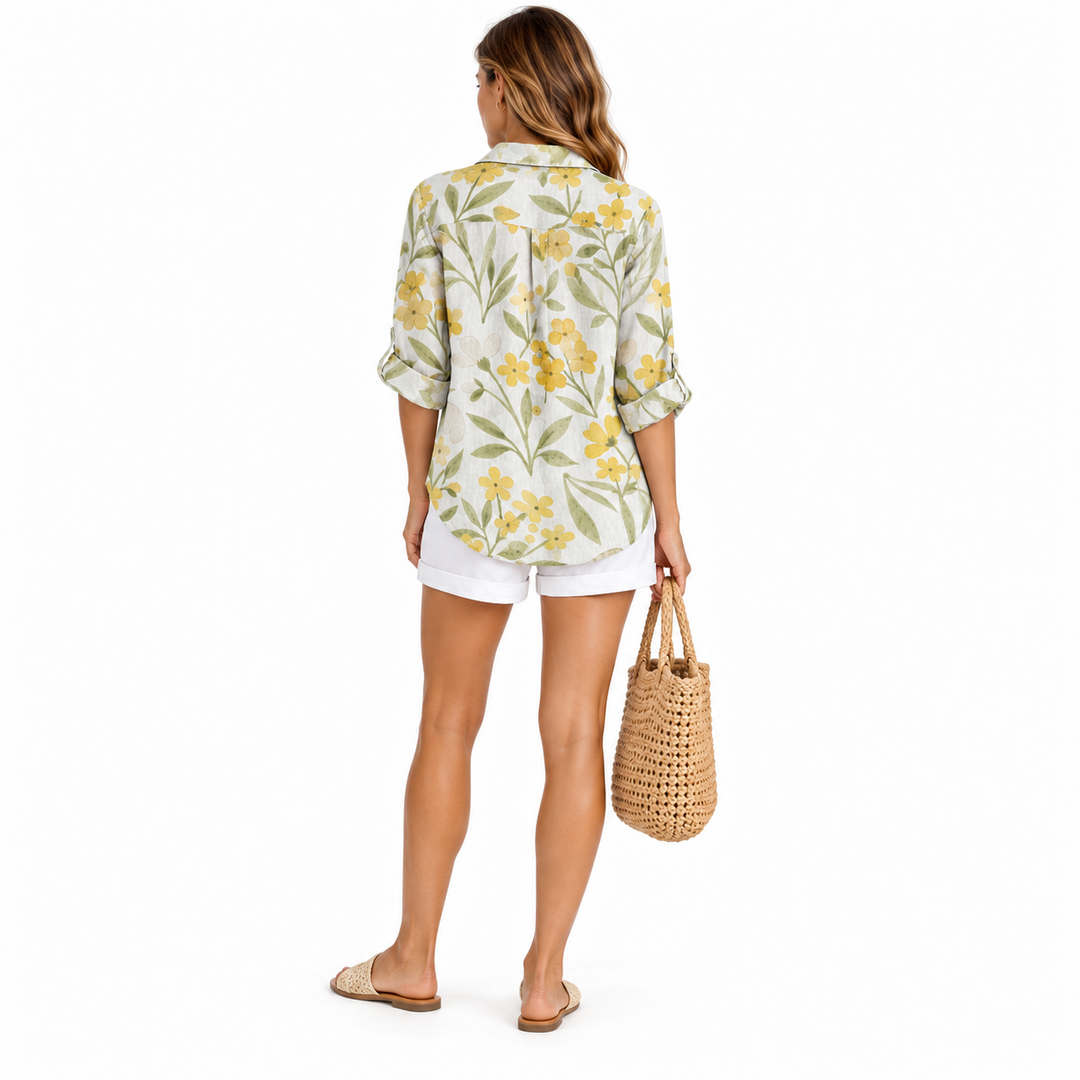 Yellow botanical printed blouse on full-body model, back view