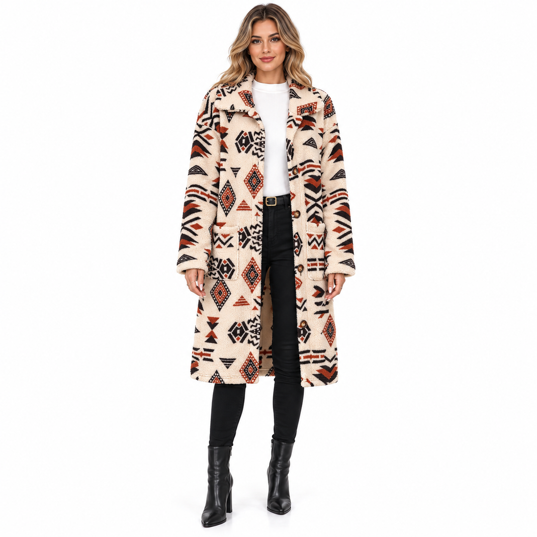 Front view of the Apricot geometric coat worn open over a white top and black trousers.