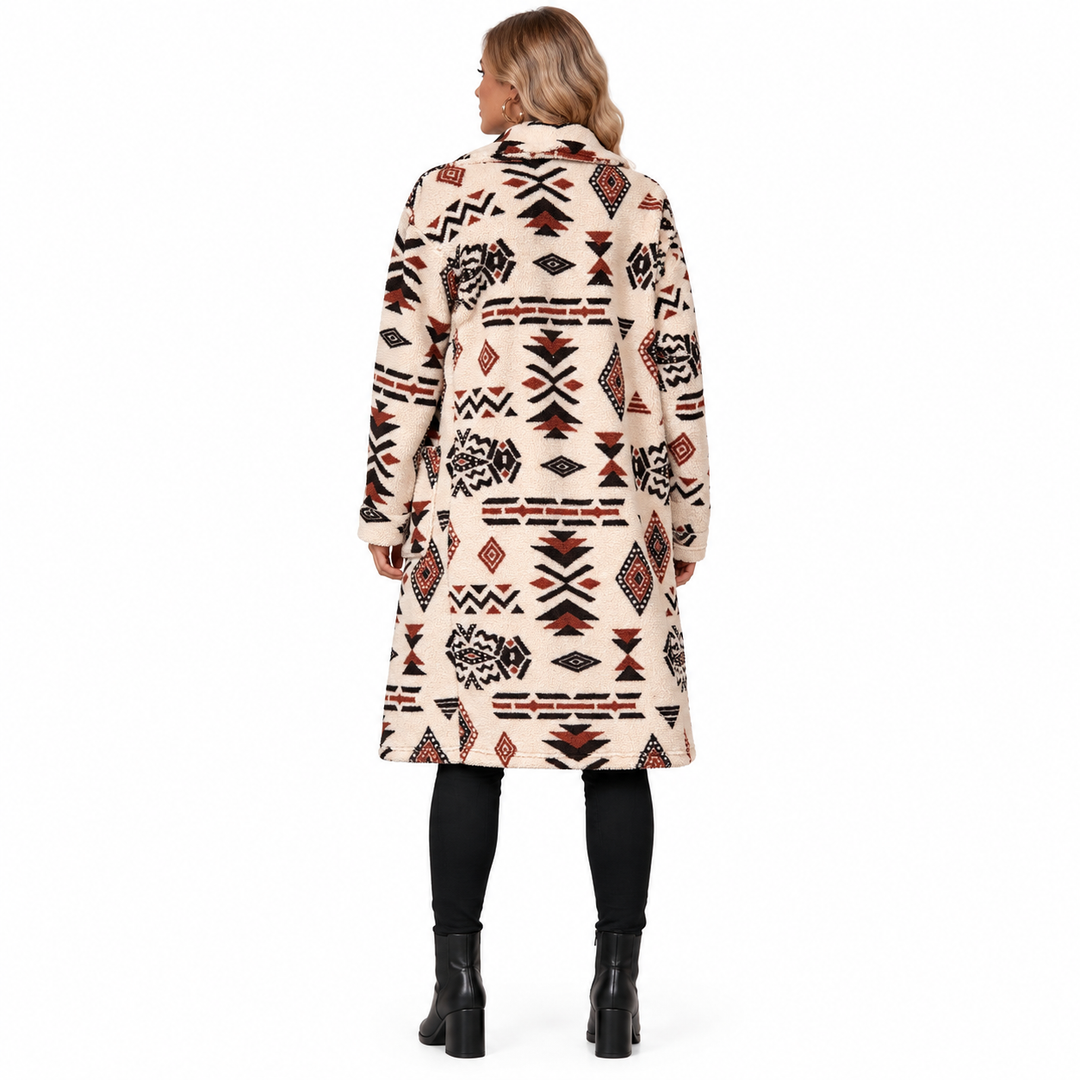 Back view of the Apricot longline coat showing the black and rust geometric pattern.