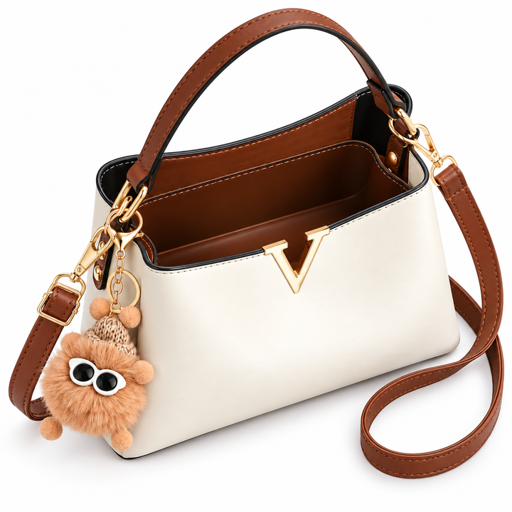 Cream shoulder bag open top view showing brown interior and gold hardware
