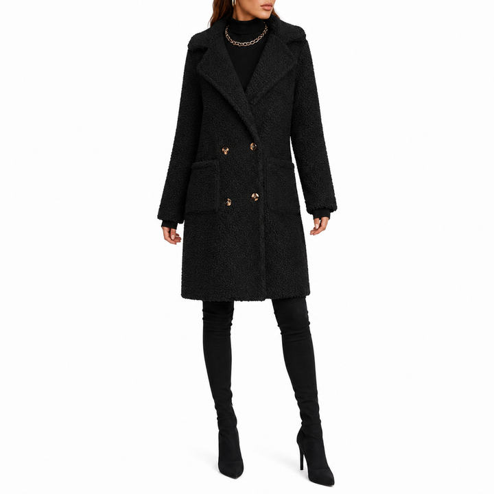 Black teddy coat front view on model showing plush texture, double-breasted button layout, patch pockets and mid-length form.