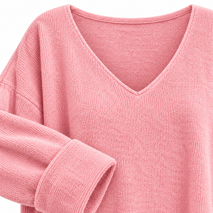 Close product view of the Pink V neckline, sleeve and visible knit texture on a clean white background
