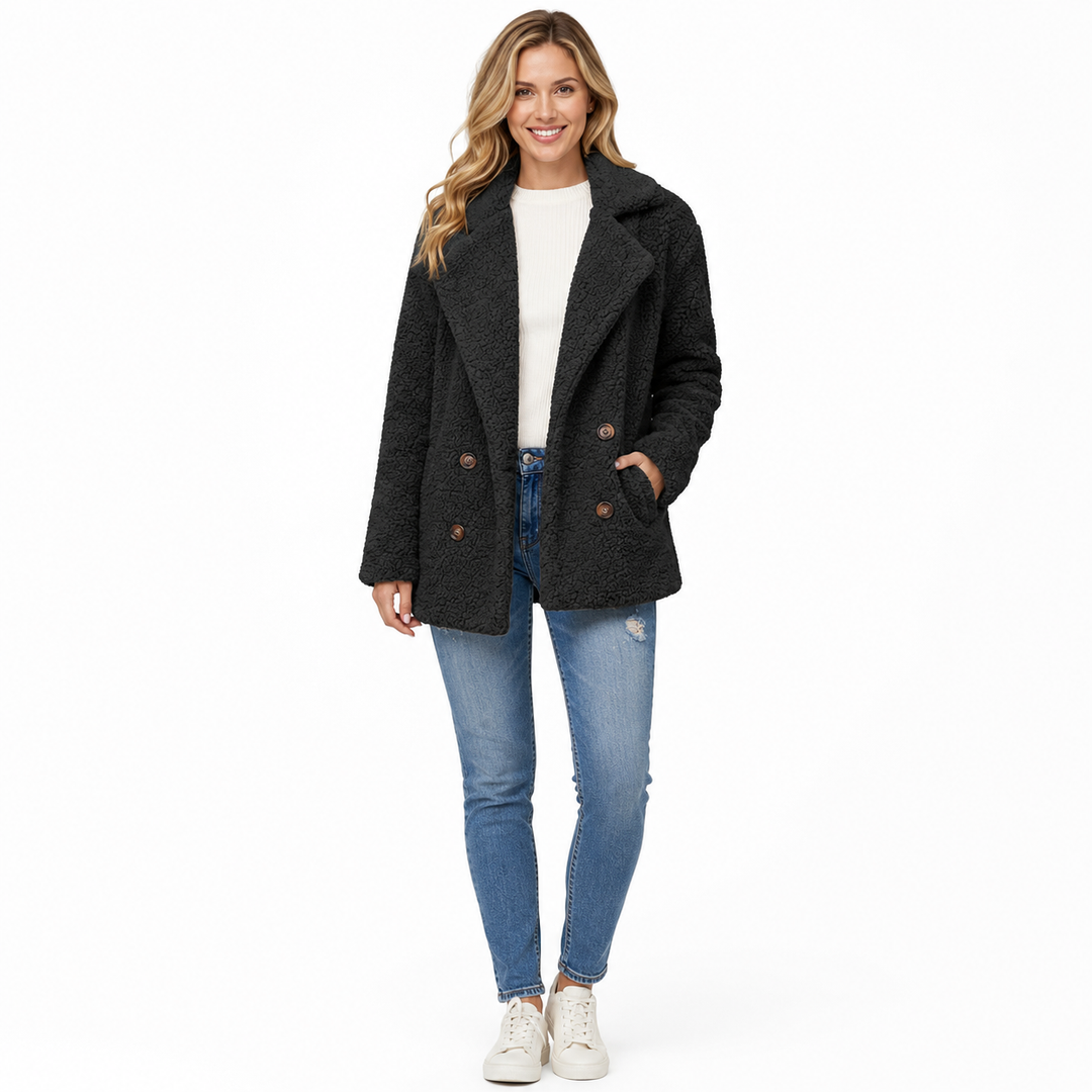 Women's black teddy winter coat front view on white background