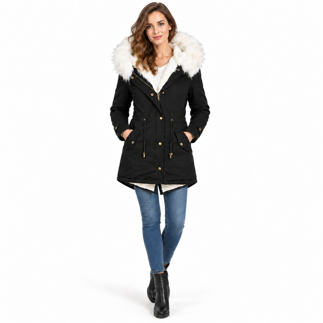 Black winter parka on model with white fur hood, zipper and button details
