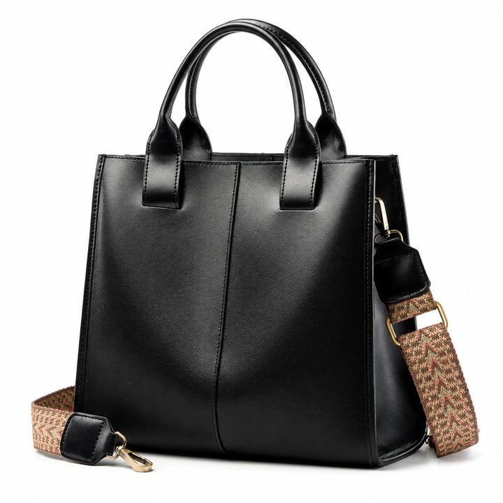 Black ZENCY shoulder bag showing its depth, handles and patterned strap at a three-quarter angle