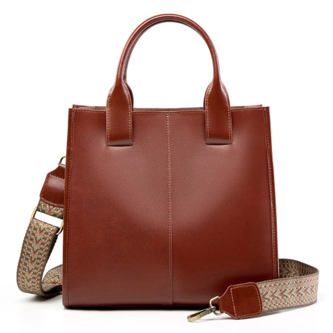 Brown ZENCY shoulder bag with short handles and patterned strap, front view