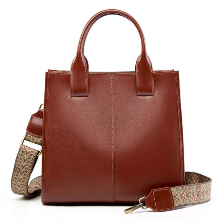 Brown ZENCY shoulder bag with short handles and patterned strap, front view